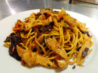 Plate of Lo Mein with Chicken, noodles tossed with chicken, wood ear mushroom, carrot and onion